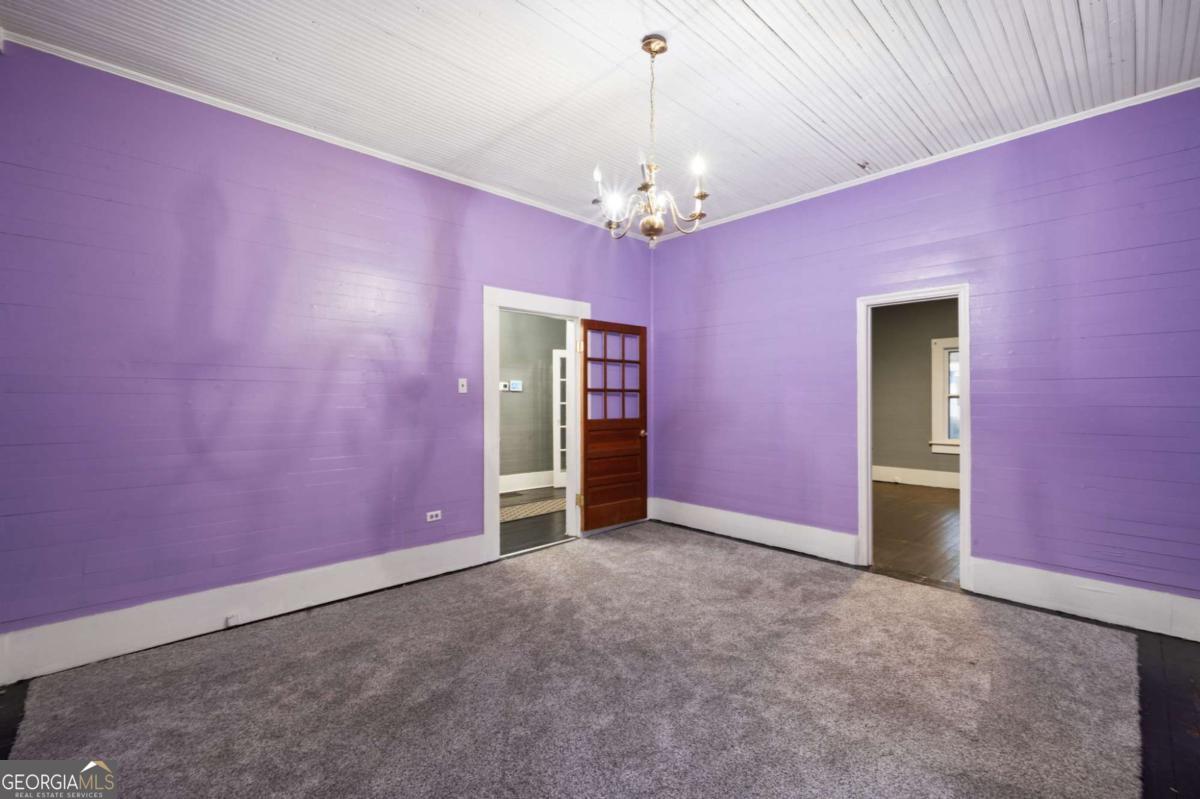 3852 New MacLand Road Powder Springs, GA 30127 - Photo 20 of 23 a view of empty room with chandelier