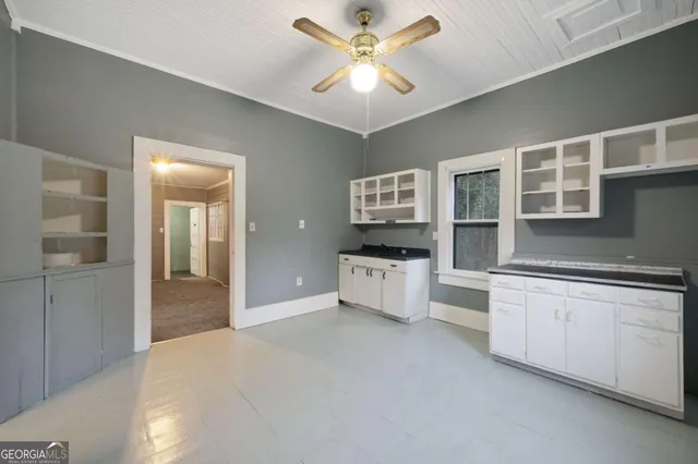 a kitchen with stainless steel appliances a stove a sink and a refrigerator