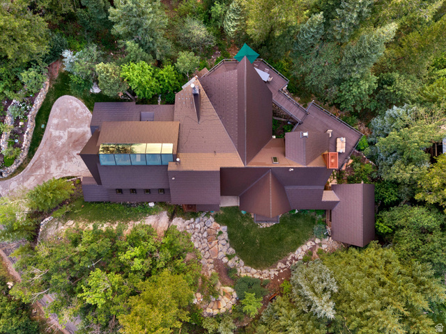 2983 East Ridgetop Road, Unit 27 Provo, UT 84604 - Photo 55 of 63 Multi-level residential structure with a brown shingled roof and integrated skylight feature
