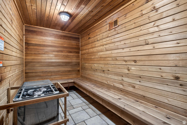 407 South Vasels Road, Unit 24 Brian Head, UT 84719 - Photo 42 of 63 Sauna / steam room with wooden walls, wooden ceiling, and stone tile flooring