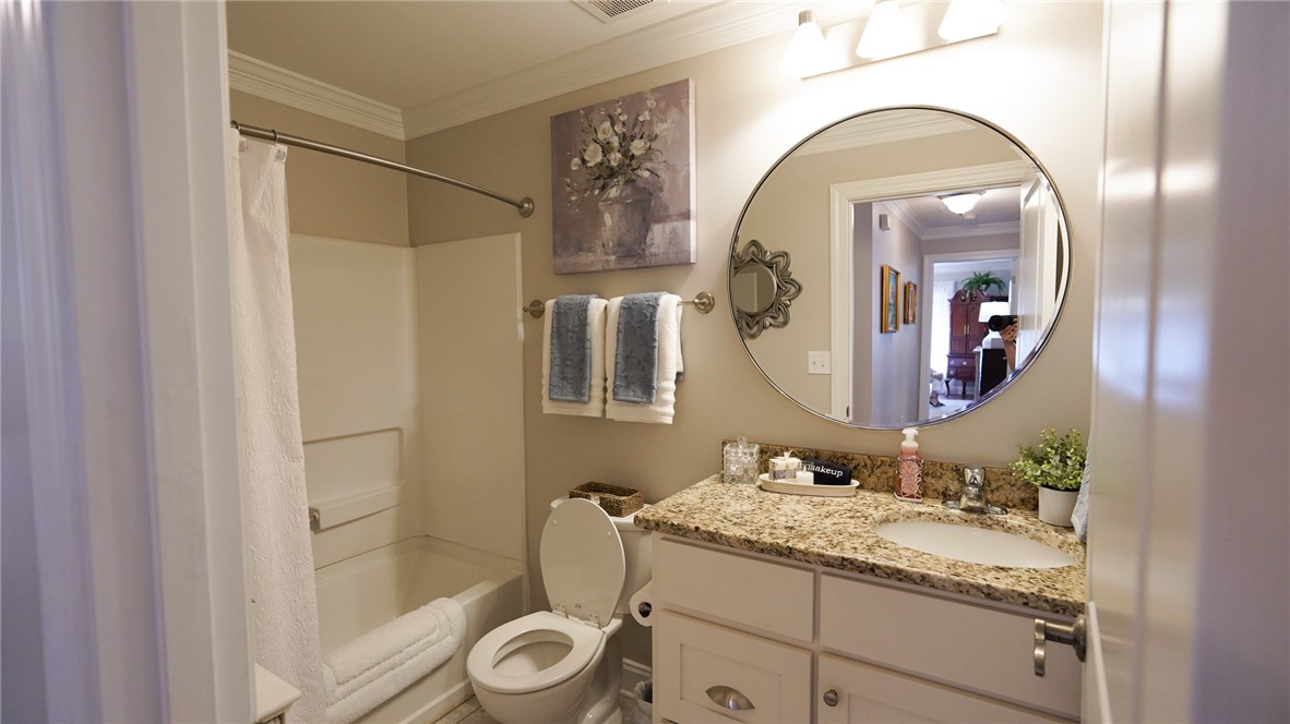 303 Lookover Drive Anderson, SC 29621 - Photo 19 of 46 This bright bathroom features a spacious shower and a vanity with ample counter space.