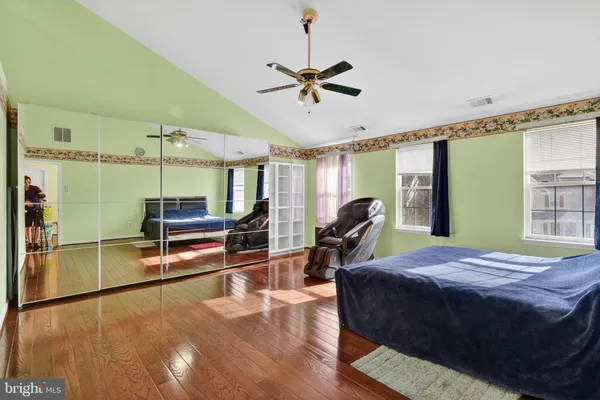 a bed room with a bed window and a chair