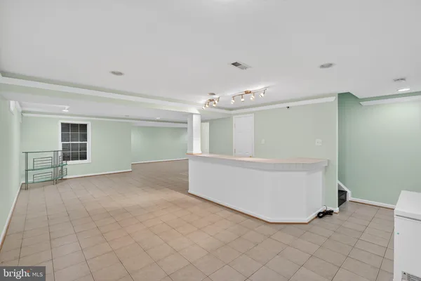 a view of an empty room with windows