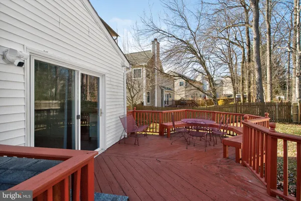a view of a house with a chairs in a patio