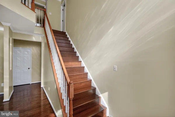 a view of staircase with wooden floor