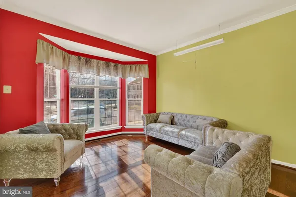 a living room with a couch and a large window