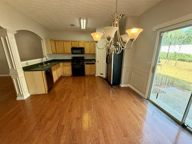 2925 Snapfinger Manor Decatur, GA 30035 - Photo 11 of 40 a kitchen with stainless steel appliances granite countertop a refrigerator a sink dishwasher a stove and white countertops with wooden floor