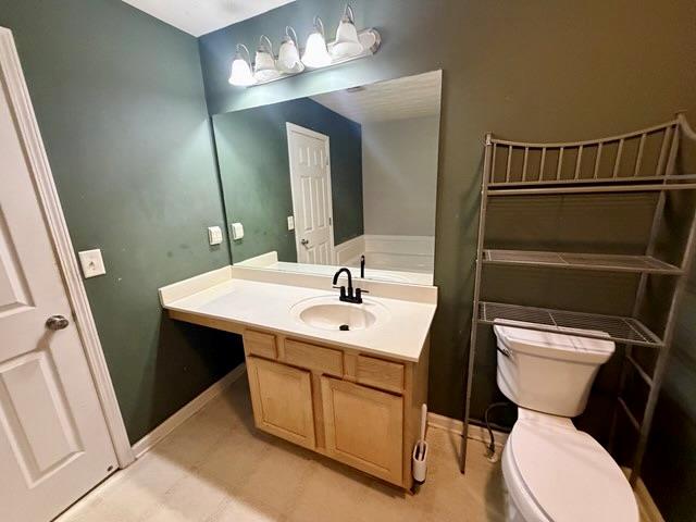 2925 Snapfinger Manor Decatur, GA 30035 - Photo 34 of 40 a bathroom with a toilet sink and mirror