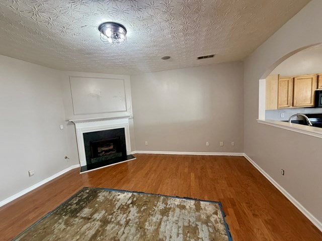 2925 Snapfinger Manor Decatur, GA 30035 - Photo 5 of 40 a view of empty room with a fireplace
