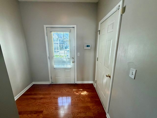 2925 Snapfinger Manor Decatur, GA 30035 - Photo 7 of 40 a view of an empty room with wooden floor and a window