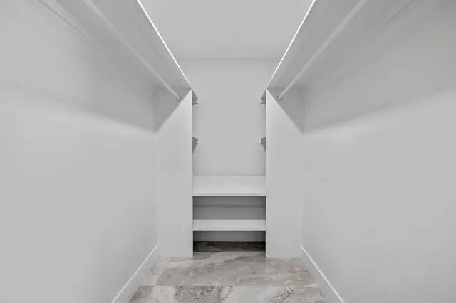 a view of an empty walk in closet