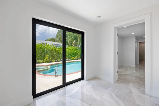 a view of empty room with floor to ceiling window