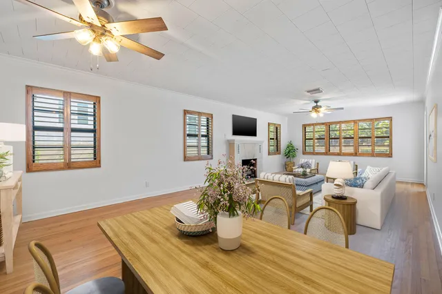 a workspace with furniture window and wooden floor
