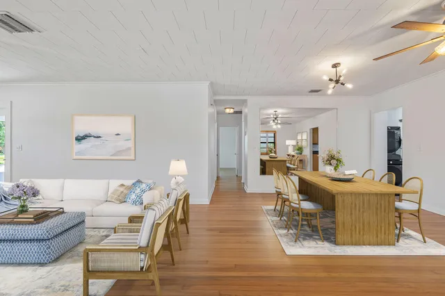 a living room with fireplace furniture and a wooden floor