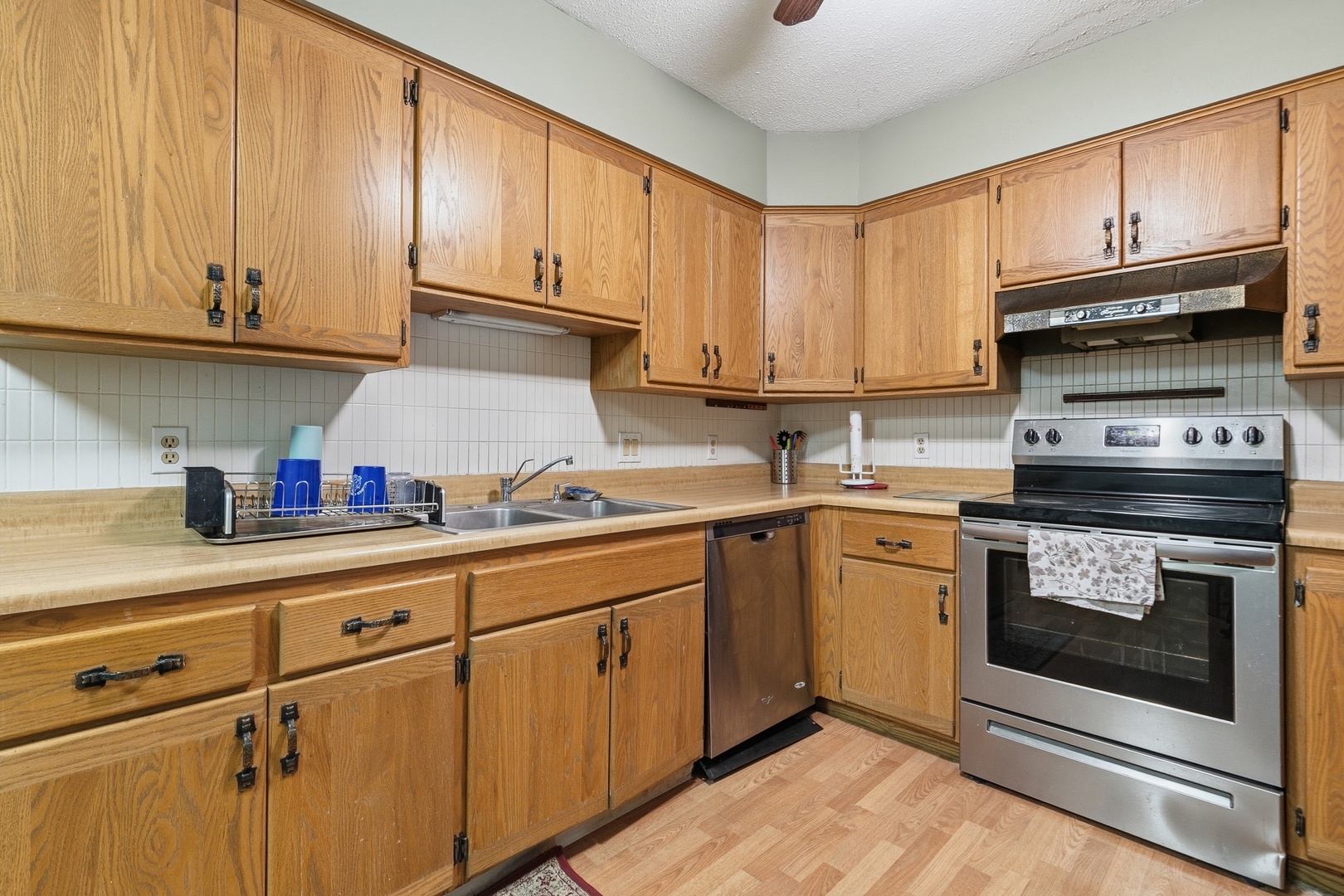 3623 34th Street Moline, IL 61265 - Photo 13 of 22 a kitchen with granite countertop cabinets stainless steel appliances and a sink