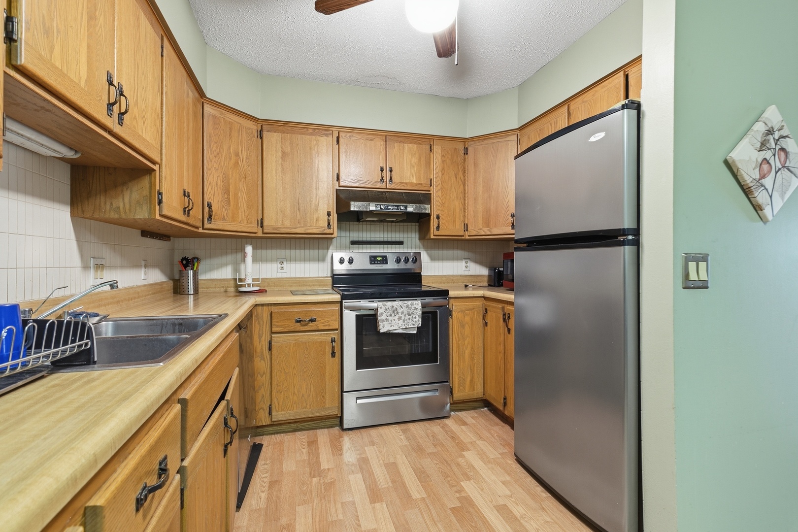 3623 34th Street Moline, IL 61265 - Photo 14 of 22 a kitchen with a refrigerator sink and stove top oven