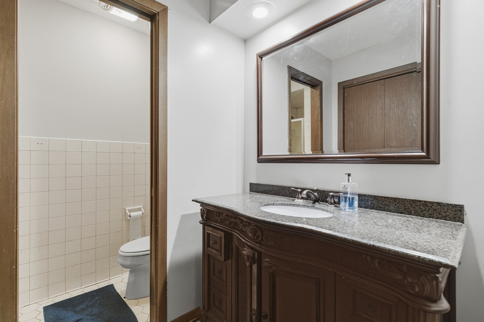 3623 34th Street Moline, IL 61265 - Photo 21 of 22 a bathroom with a granite countertop sink toilet and mirror