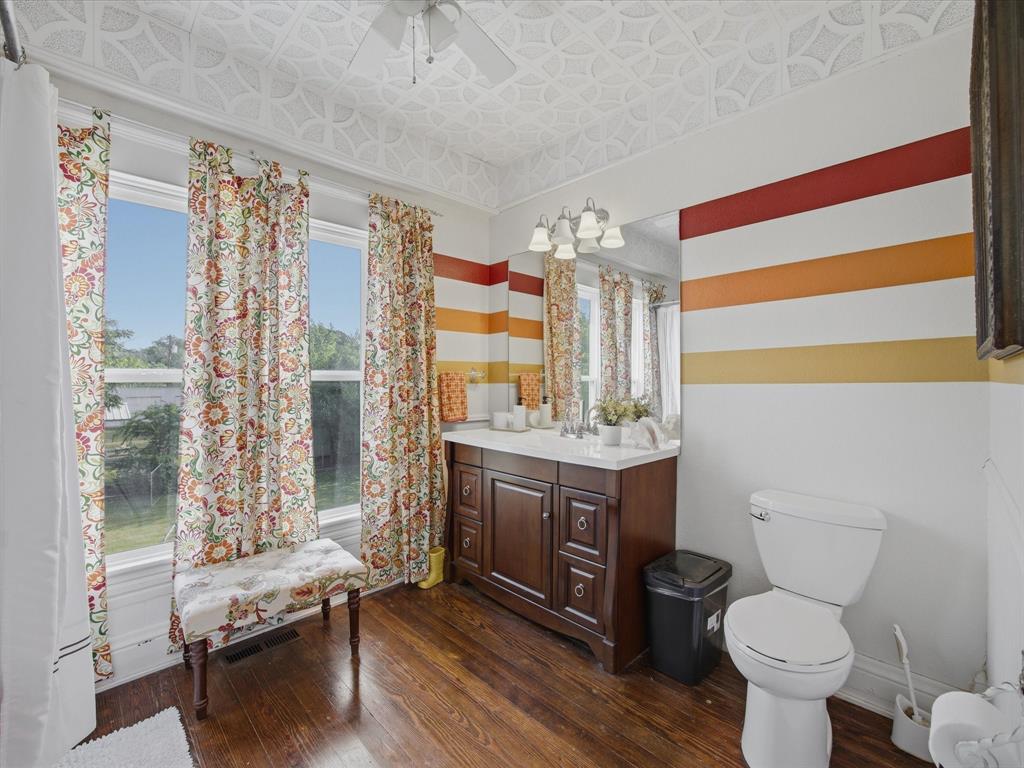 907 4th Street Graham, TX 76450 - Photo 21 of 34 a bathroom with a sink toilet and shower