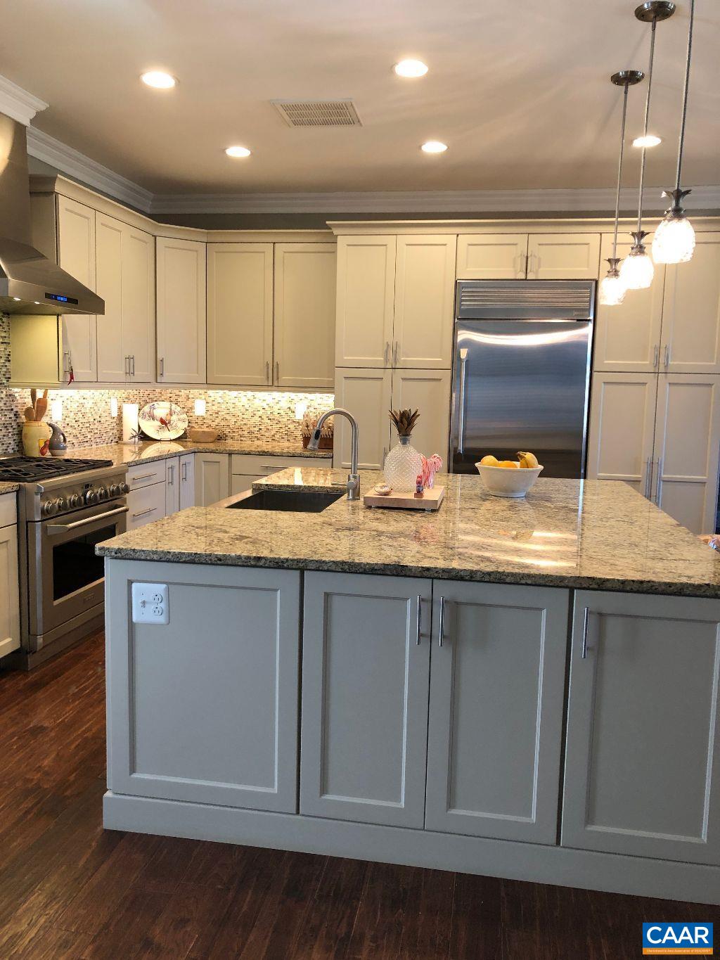 2150 C Moore Road, Unit LOT 7 Ruckersville, VA 22968 - Photo 7 of 7 a kitchen with stainless steel appliances granite countertop a sink a stove and a microwave