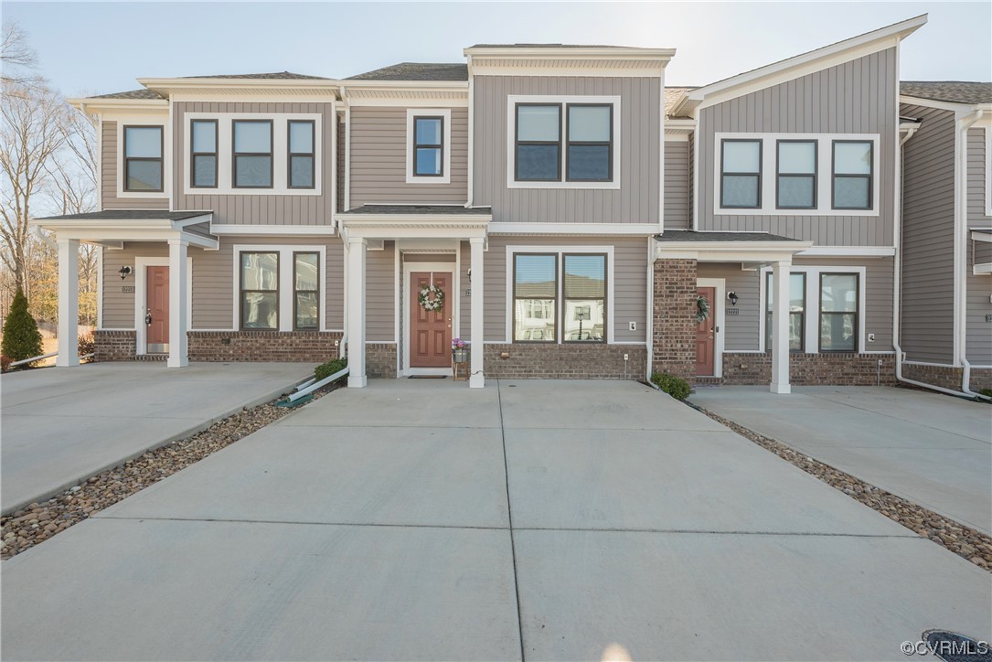 12217 Dutch Elm Circle Midlothian, VA 23112 - Photo 1 of 45 a view of a house with a parking area