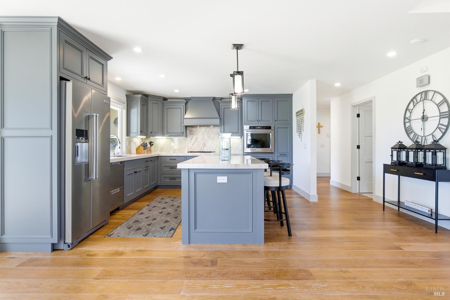 334 Miramonte Way Santa Rosa, CA 95409 - Photo 11 of 46 a kitchen with stainless steel appliances kitchen island granite countertop a refrigerator a sink a stove and oven