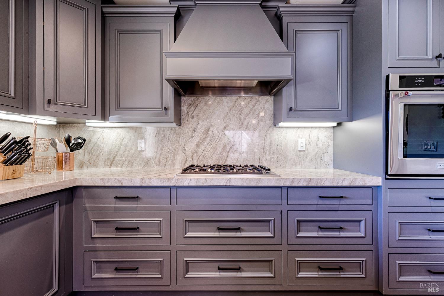 334 Miramonte Way Santa Rosa, CA 95409 - Photo 14 of 46 a stove top oven sitting inside of a kitchen and granite counter tops