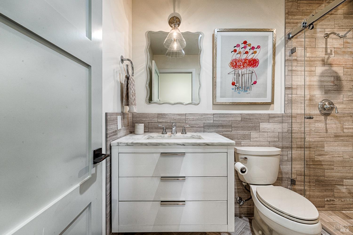 334 Miramonte Way Santa Rosa, CA 95409 - Photo 26 of 46 a bathroom with a toilet sink and mirror