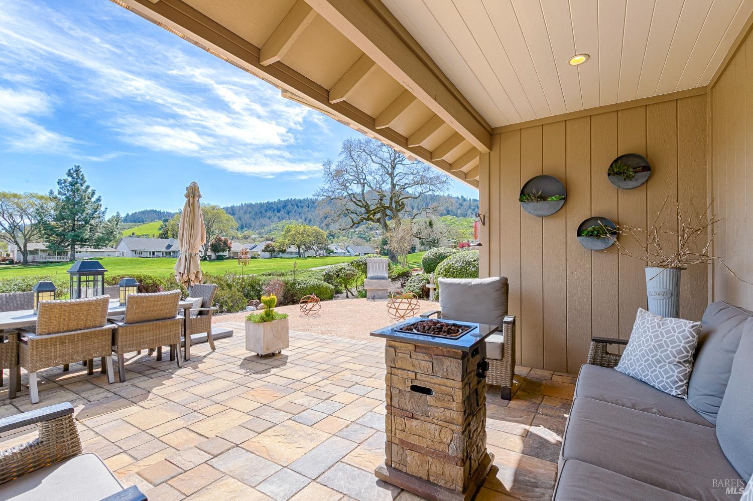 334 Miramonte Way Santa Rosa, CA 95409 - Photo 29 of 46 a living room with patio furniture and garden view