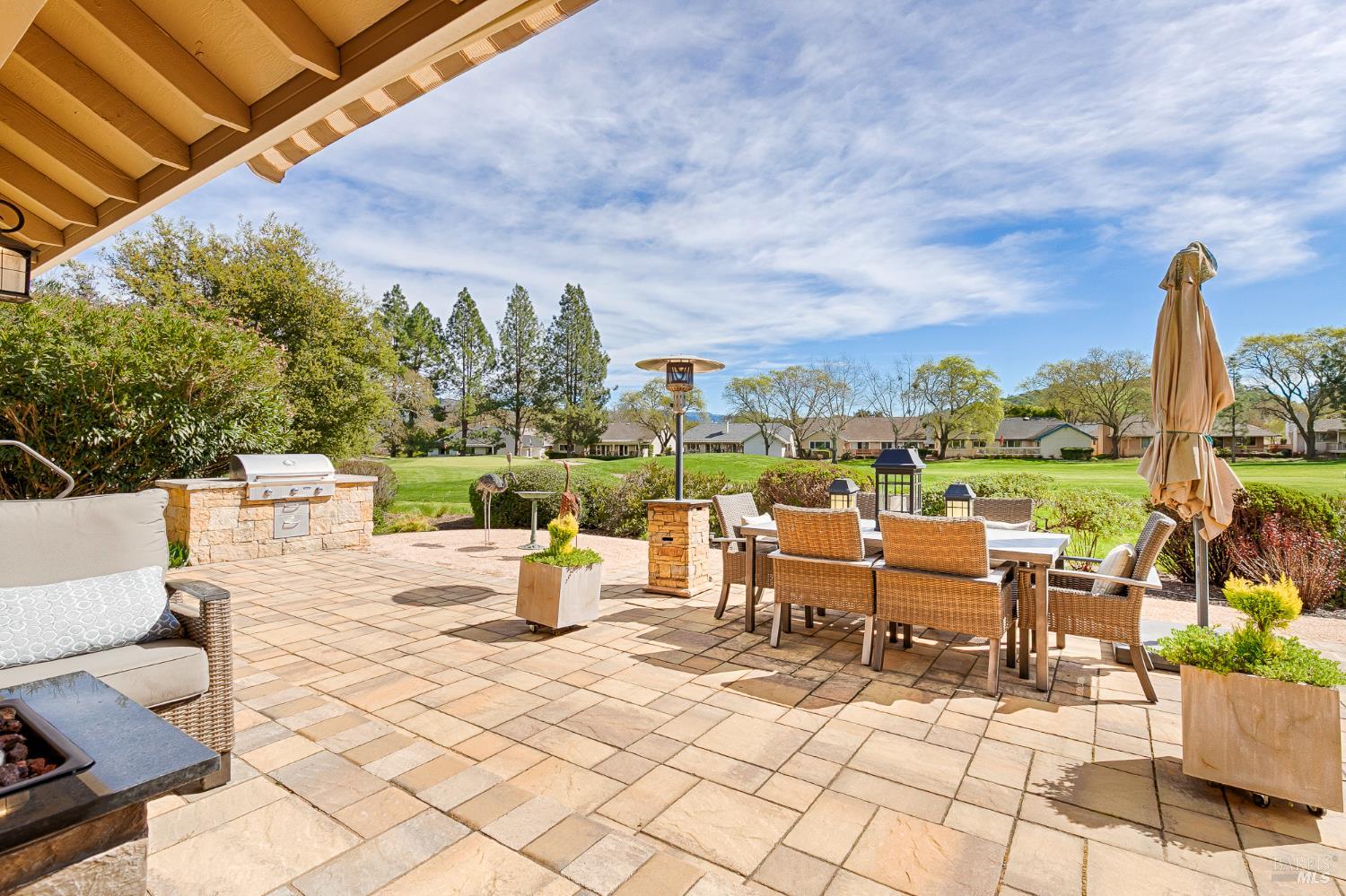 334 Miramonte Way Santa Rosa, CA 95409 - Photo 33 of 46 a view of a patio with a dining table and chairs with wooden fence