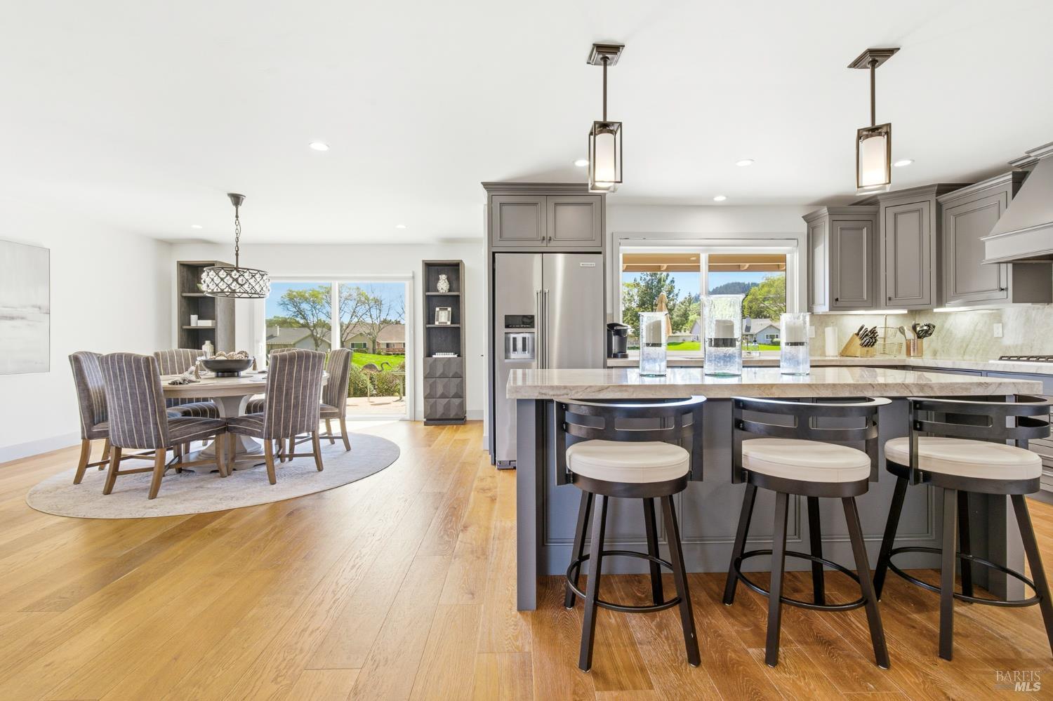 334 Miramonte Way Santa Rosa, CA 95409 - Photo 8 of 46 a kitchen with stainless steel appliances kitchen island granite countertop a table and chairs in it