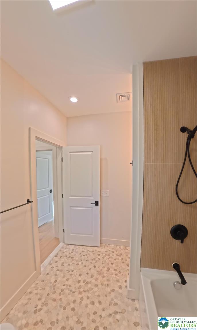 41 South 2nd Street Emmaus, PA 18049 - Photo 26 of 37 a bathroom with a sink and a shower