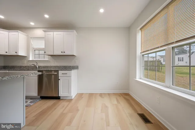 a kitchen with a stove a sink and a refrigerator