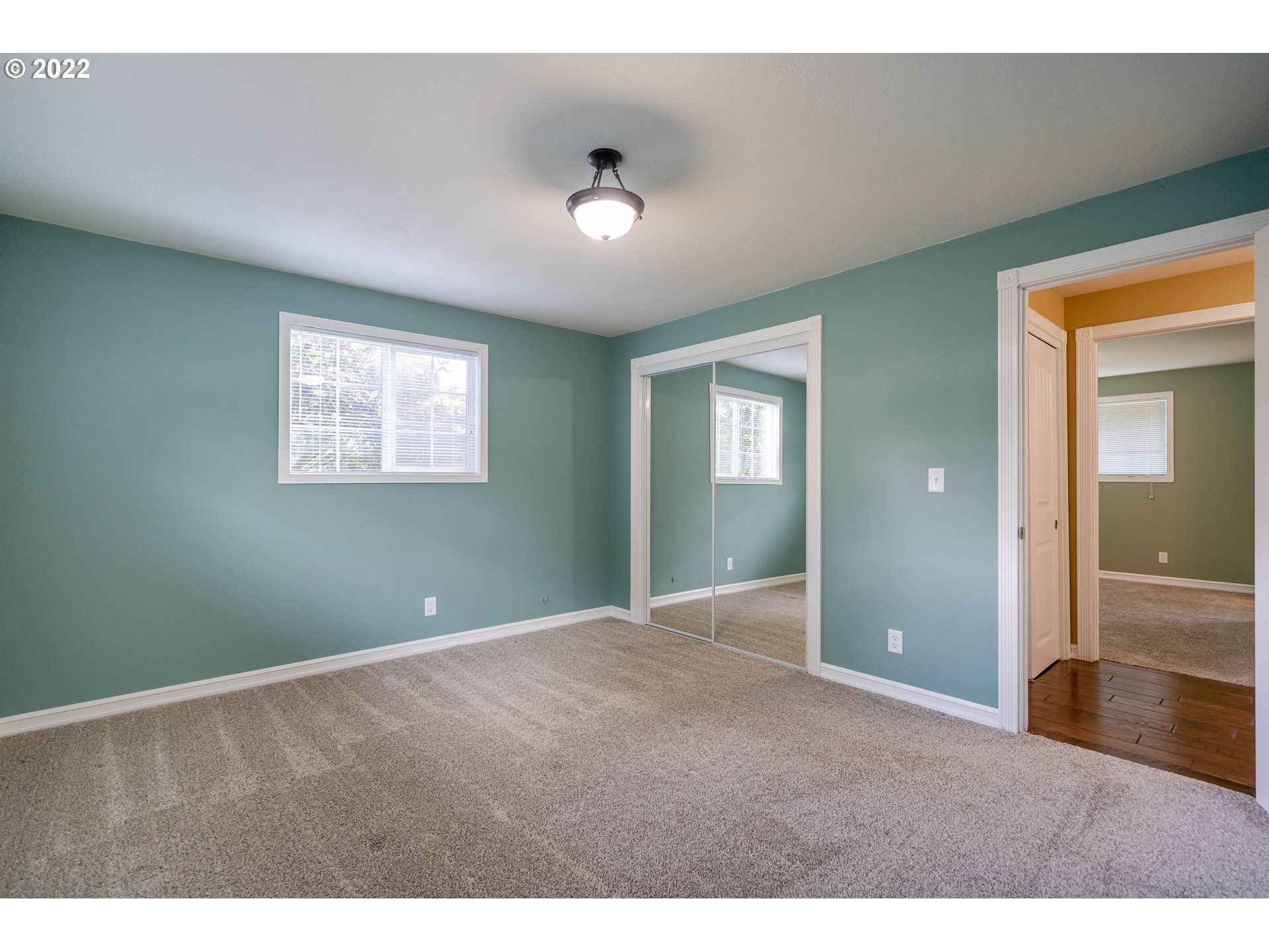 87817 Cedar Flat Road Springfield, OR 97478 - Photo 15 of 32 a view of an empty room with window and wooden floor