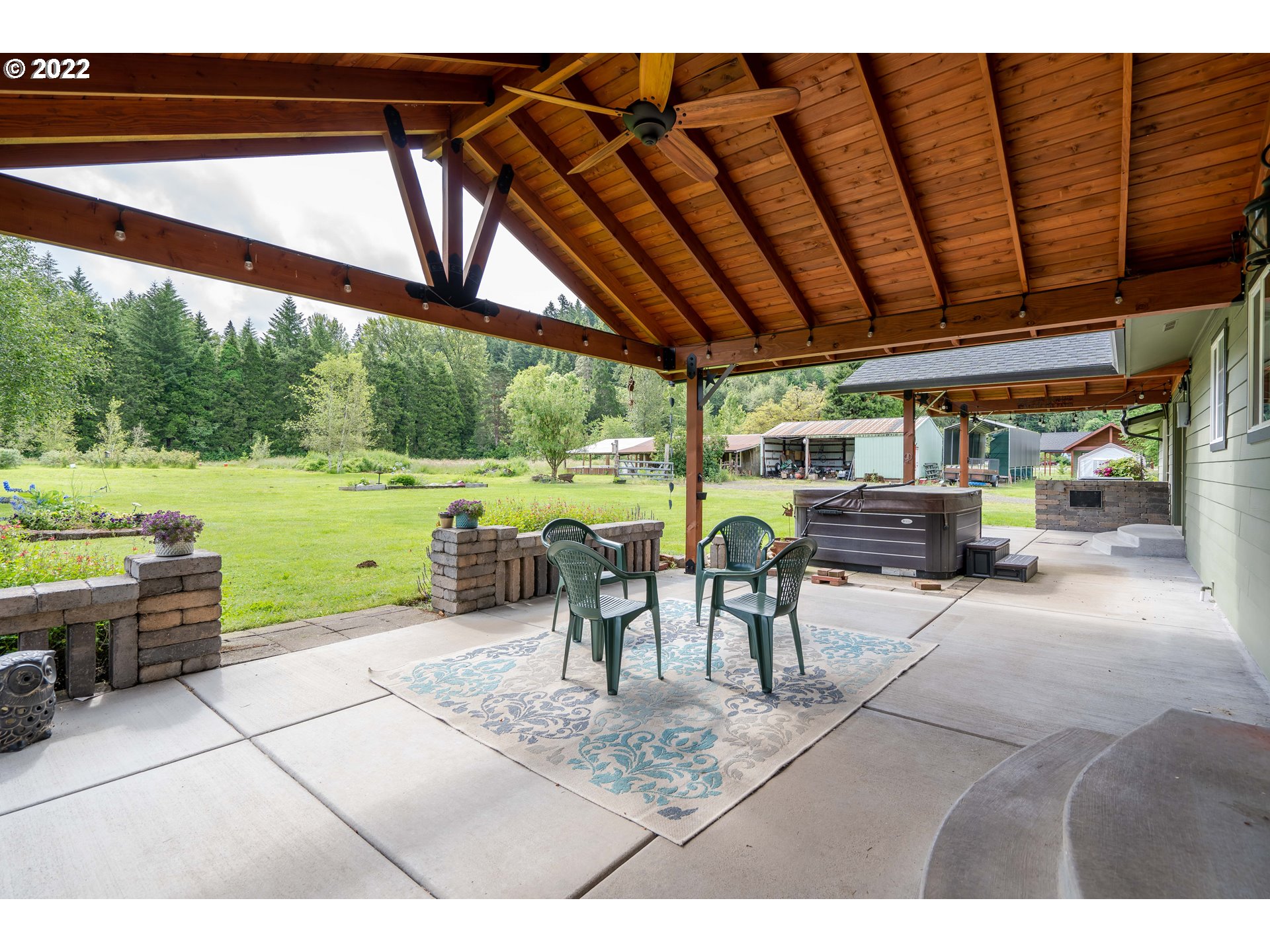 87817 Cedar Flat Road Springfield, OR 97478 - Photo 20 of 32 a view of a porch with furniture and a backyard