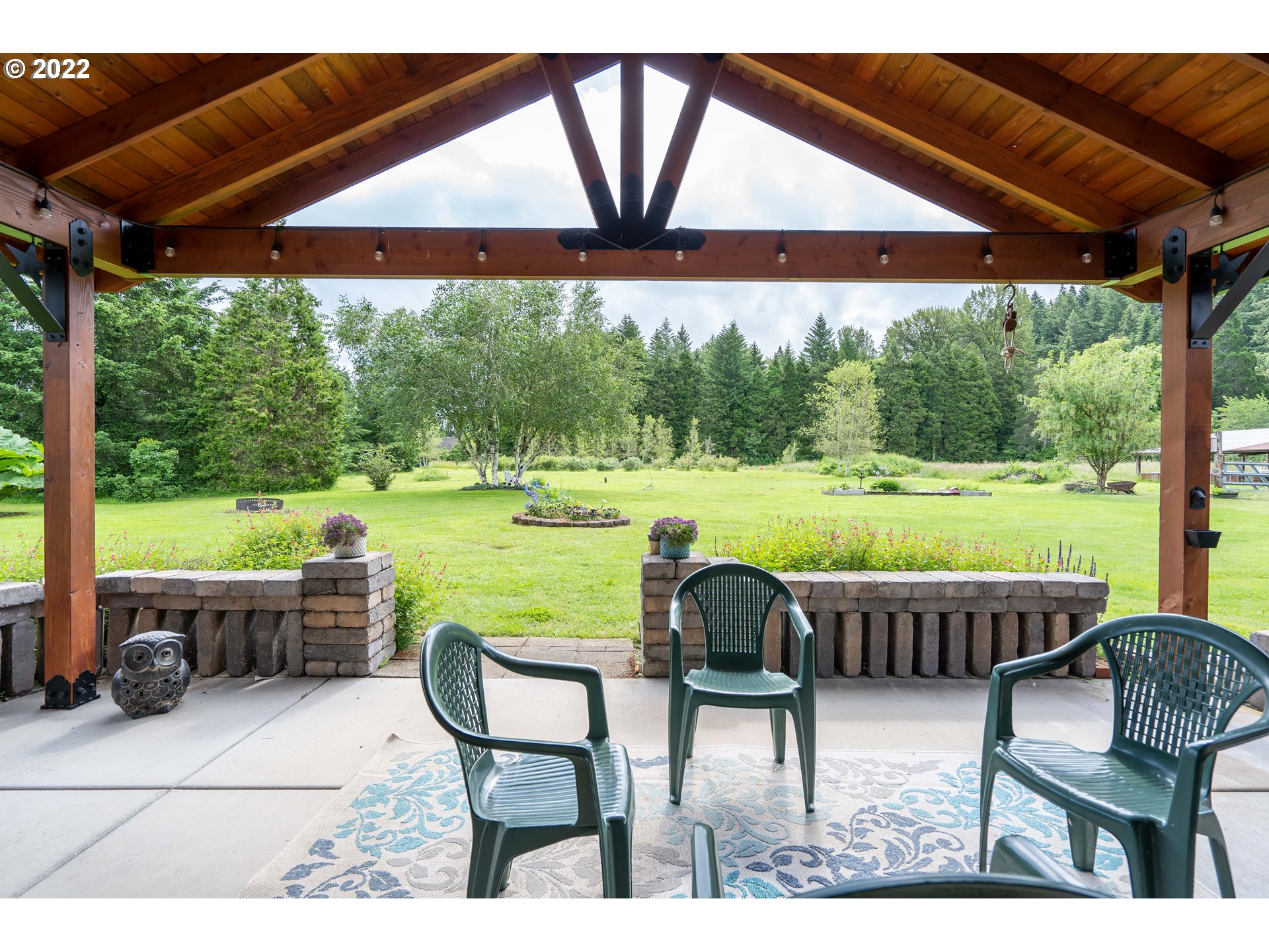 87817 Cedar Flat Road Springfield, OR 97478 - Photo 21 of 32 a patio with glass top table and chairs