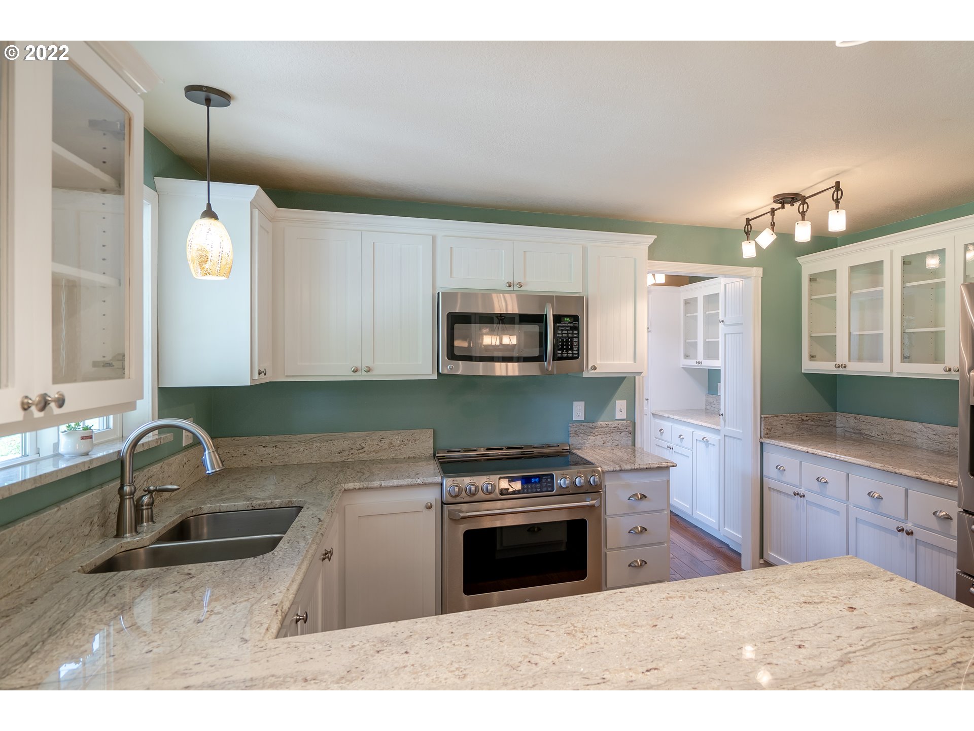 87817 Cedar Flat Road Springfield, OR 97478 - Photo 6 of 32 a kitchen with a sink cabinets and stainless steel appliances