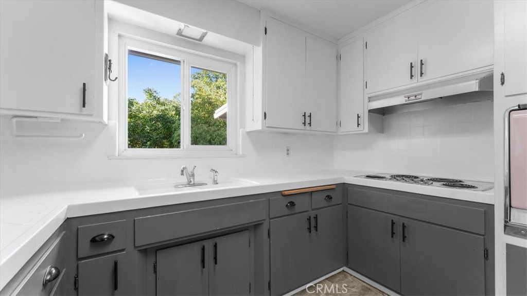 3658 Rodgers Avenue Chico, CA 95928 - Photo 13 of 52 a kitchen with a sink cabinets and window