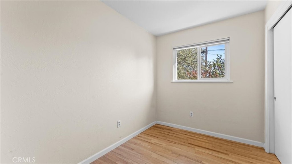 3658 Rodgers Avenue Chico, CA 95928 - Photo 23 of 52 a view of an empty room with wooden floor and a window