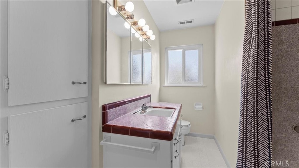 3658 Rodgers Avenue Chico, CA 95928 - Photo 25 of 52 a bathroom with a sink and a mirror