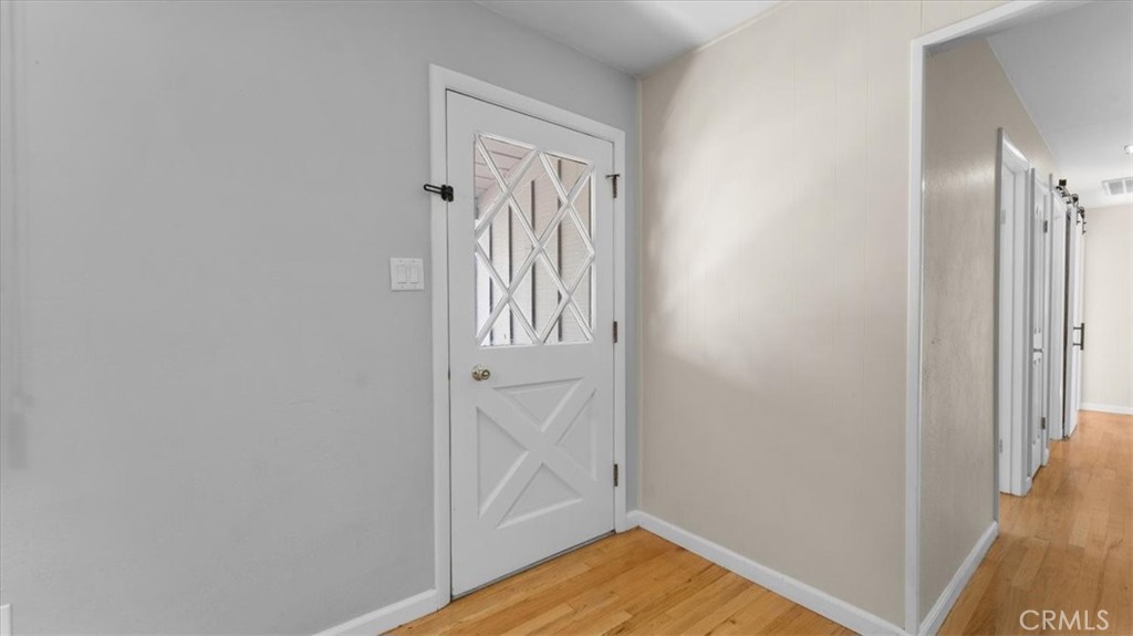 3658 Rodgers Avenue Chico, CA 95928 - Photo 3 of 52 a view of a hallway with wooden floor