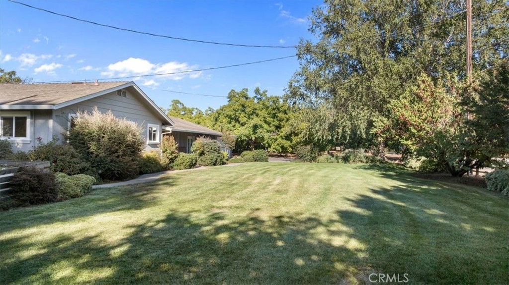 3658 Rodgers Avenue Chico, CA 95928 - Photo 34 of 52 a yellow house with trees in front of it