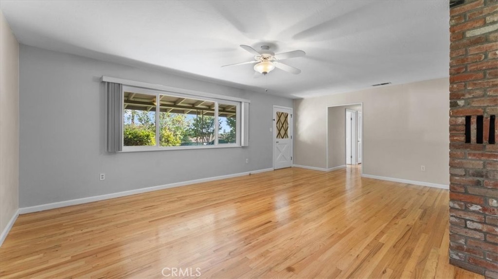 3658 Rodgers Avenue Chico, CA 95928 - Photo 4 of 52 a view of an empty room with wooden floor and a window