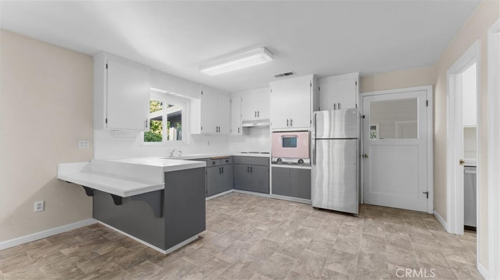 3658 Rodgers Avenue Chico, CA 95928 - Photo 8 of 52 a kitchen with refrigerator and window