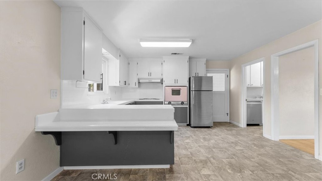 3658 Rodgers Avenue Chico, CA 95928 - Photo 9 of 52 a kitchen with refrigerator and cabinets