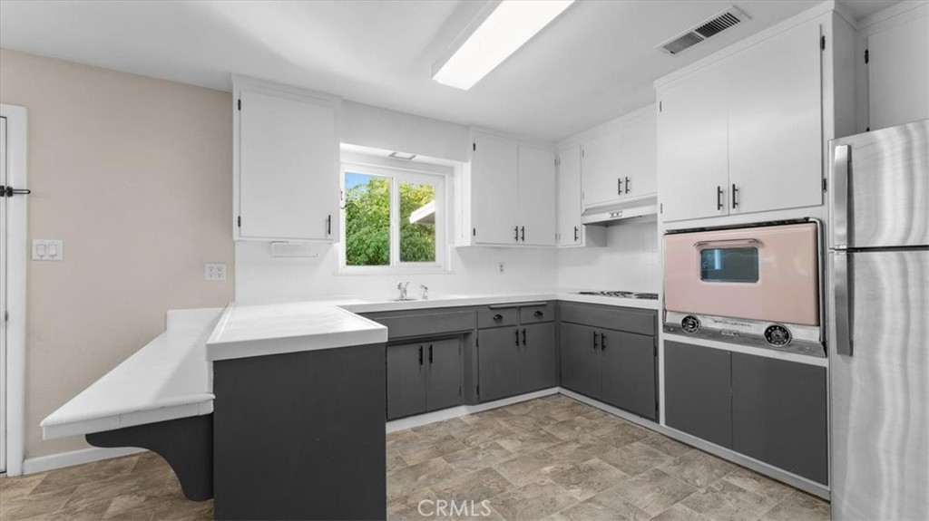 3658 Rodgers Avenue Chico, CA 95928 - Photo 10 of 52 a kitchen with a sink appliances and cabinets