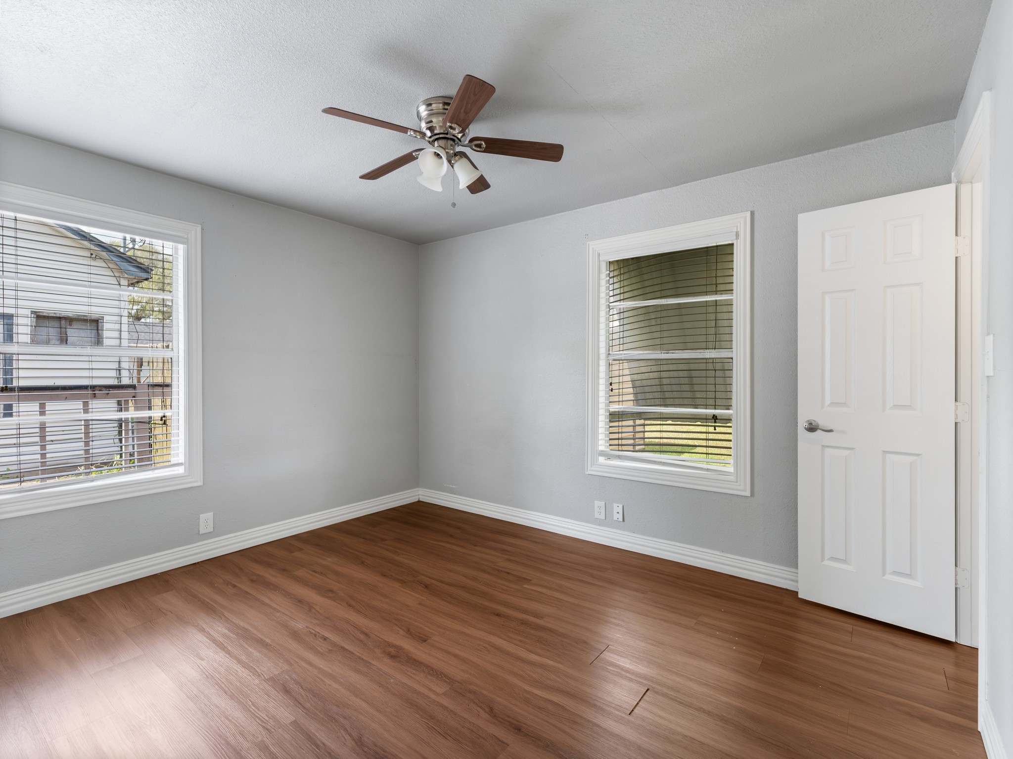 1921 Foote Street Wharton, TX 77488 - Photo 11 of 18 a view of an empty room with wooden floor and a window