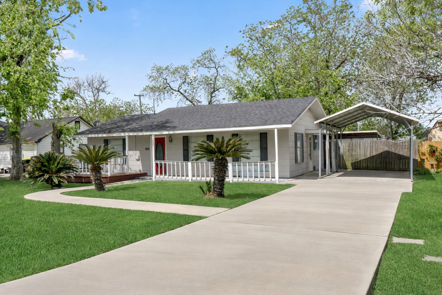 1921 Foote Street Wharton, TX 77488 - Photo 2 of 18 a front view of a house with a yard and green space