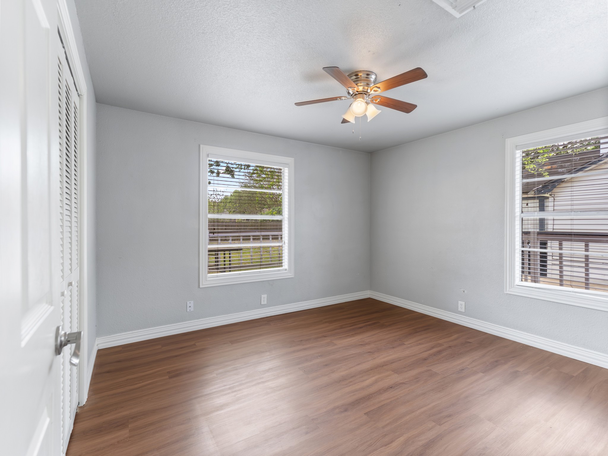 1921 Foote Street Wharton, TX 77488 - Photo 8 of 18 a view of an empty room with wooden floor and a window