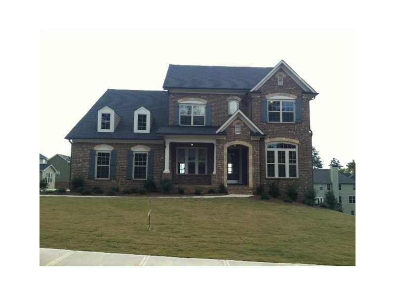 Exterior Front. Cambridge Plan with 3 sides brick and side entry garage