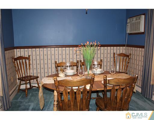 24 Old Post Road Edison, NJ 08817 - Photo 3 of 22 a dining room with furniture and wooden floor